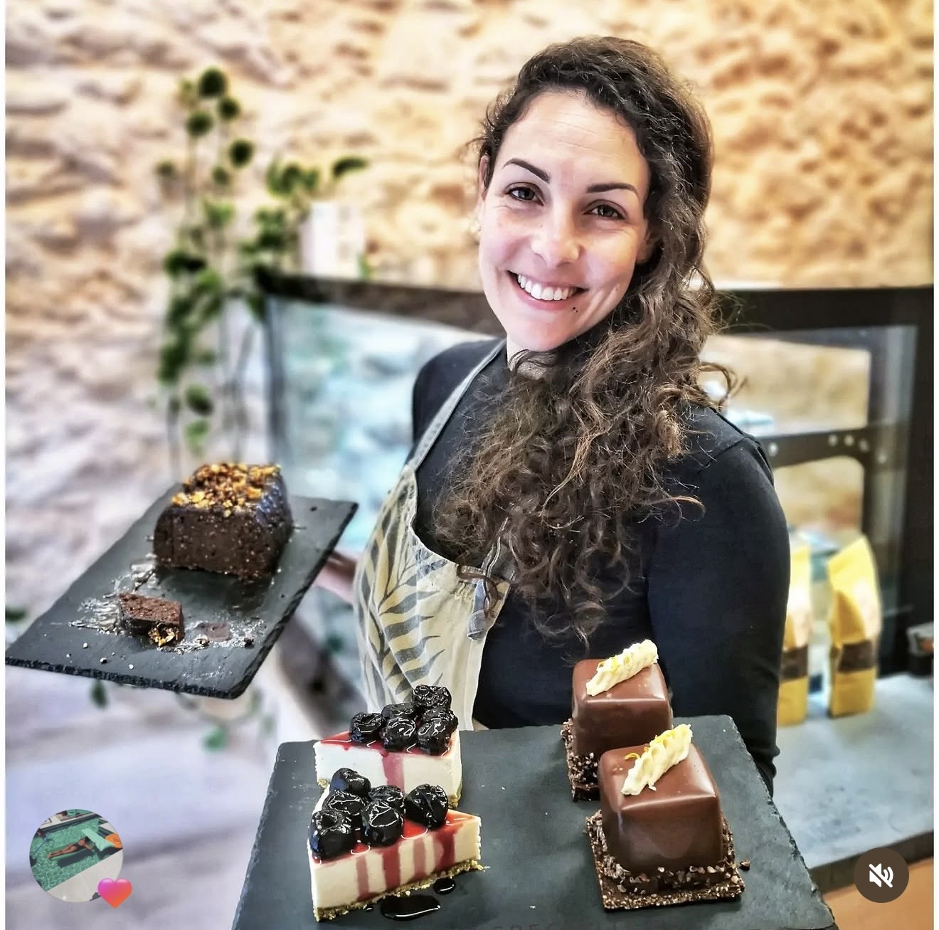 Elli, the maker, holding handcrafted desserts